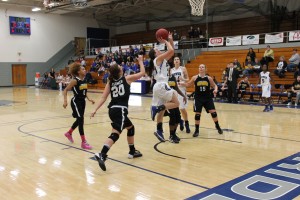 Tiffany Rhame, freshman #21, attempts to score some game points for the Lady 'Riders during the game against Three Rivers on Jan. 18.